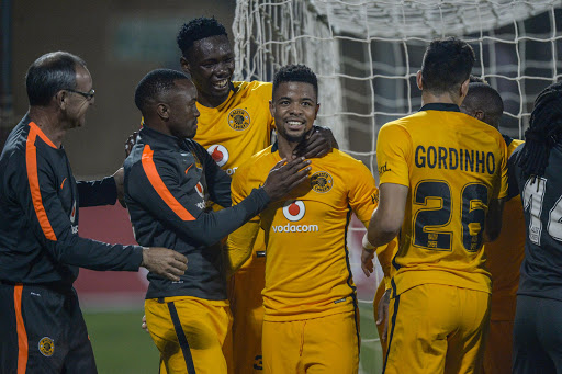 George Lebese of Kaizer Chiefs is joined by teammates to celebrates after scoring a penalty during the Absa Premiership match between Highlands Park and Kaizer Chiefs at Makhulong Stadium on September 21, 2016 in Johannesburg, South Africa.