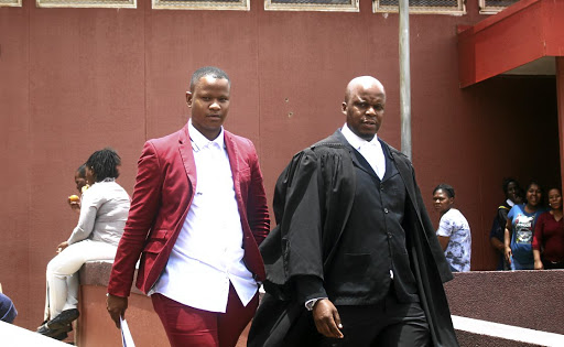 'Idols SA' runner-up Mthokozisi Ndaba with his lawyer James Ndebele at the Hillbrow Magistrate's Court, where his assault charge was withdrawn. /Kabelo Mokoena