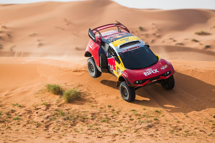 Sebastien Loeb, who lost his way and precious time in the desert on Monday, finished the 417km stage from Ha'il to Al Ula four minutes and 14 seconds ahead of Sainz despite being slowed by two punctures.