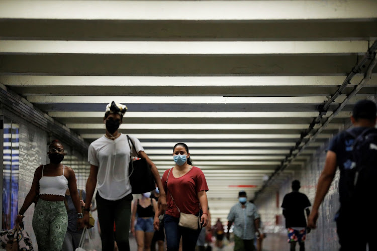 People wear masks as they pass through a pedestrian subway in New York City, New York, the US, July 26 2021. Picture: REUTERS/ANDREW KELLY