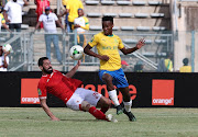 Man of the match Themba Zwane of Sundowns tackled by Ahmed Fathy of Al Ahly on Saturday.