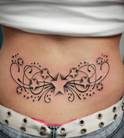 Twinkling Stars Lower Back Tattoo