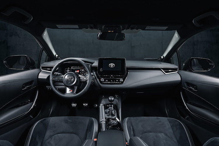 Body-hugging sports seats in the Circuit Edition are upholstered in a racy mix of suede and synthetic leather with contrasting red stitching. Picture: SUPPLIED