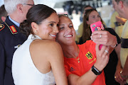 Meghan Markle takes selfies with Invictus athletes at the One Year To Go event.