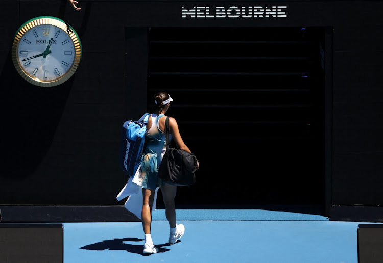 Spain's Garbine Muguruza walks out after losing her second round match against France's Alize Cornet at Melbourne Park on January 20 2022.