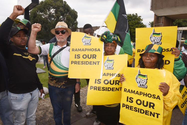 December 05, 2022.ANC members carrying placards demostrate outside in support of President Cyril Ramaphosa and Carl Niehaus carrying Photoframe 'Ramaphosa must GO' at the ANC special NEC meeting at Nasrec EXPO Centre in Johannesburg.