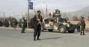 Afghan security forces keep watch at the site of an attack in Kabul, Afghanistan December 18 ,2017. 