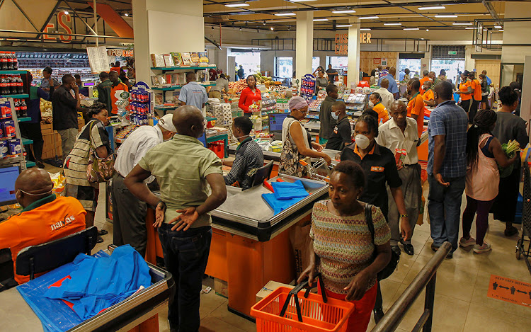 A general view shows customers shopping for essential commodities at a Naivas Supermarket, as residents stock their homes amid concerns about the spread of coronavirus in Nairobi, Kenya March 23, 2020. REUTERS