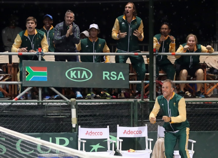 SA captain Marcos Ondruska and the SA team celebrate after Nik Scholtz won against Grega Zemlja (SLO) during the opening singles of the Davis Cup tie between South Africa and Slovenia at the Irene Country Club on April 07, 2017 in Pretoria.