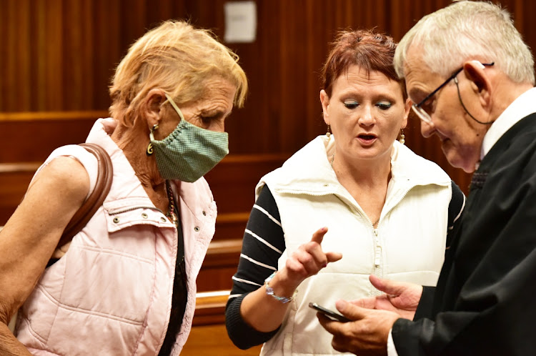 Christine and Chantell Russouw speak to their lawyer, Hans Bester, ahead of sentencing on Wednesday.