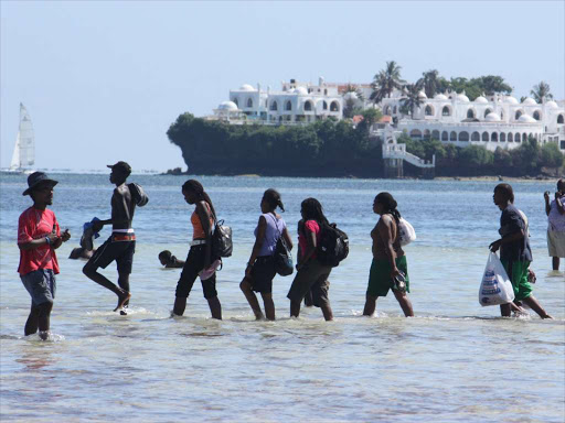 Domestic tourists at Jomo Kenyatta Beach in Mombasa during a past Easter Holiday Holiday/