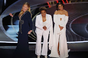 Amy Schumer and Wanda Sykes, pictured here with co-host Regina Hall, have spoken out against Will Smith's assault of Chris Rock at the Oscars.