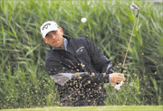 Thomas Bjorn of Denmark hits from a bunker during the first round of The 140th Open Championship at Royal St George's in Sandwich, England yesterday. Bjorn was the early leader in the clubhouse with a five-under-par score of 65 Picture: ANDREW REDINGTON/GALLO IMAGES