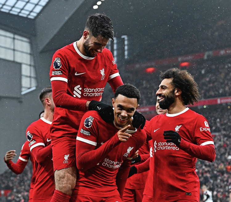 Mohamed Salah (right) celebrates with his Liverpool team mates in a past match.