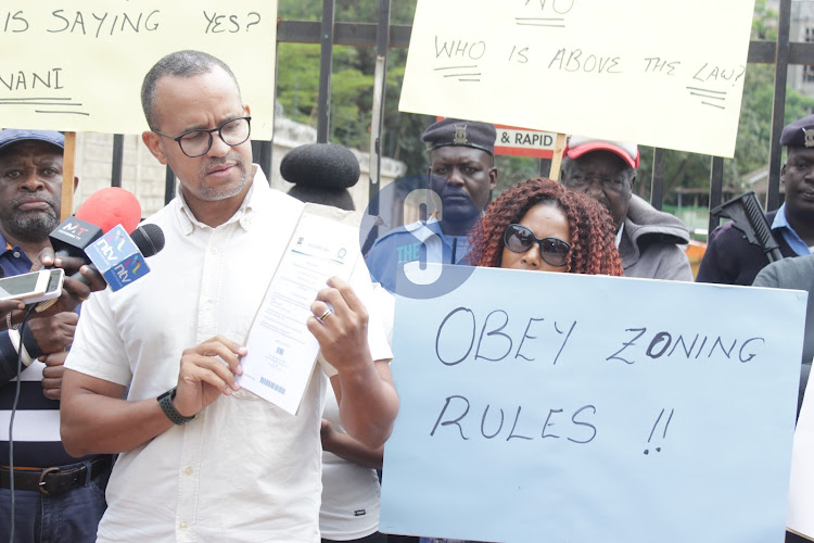 Mbaazi area chairman Benard Kinara shows the Court injunction letter seeking to stop the construction of a 13 storey building of 512 units on October 26,2023