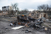 Destroyed Russian military vehicles are seen on the street on April 4, 2022 in Bucha, Ukraine. The Ukrainian government has accused Russian forces of committing a 