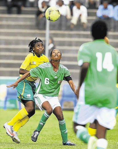 Nothando Vilakazi of Banyana Banyana fights for the ball with Felistas Muzongondi of Zimbabwe during the international friendly match at Sinaba stadium, Daveyton, yesterday Picture: SYDNEY SESHIBEDI