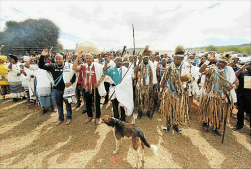 UNSUNG HERO: AmaXhosa King Mpendulo Sigcawu is flanked by royal family members and traditional healers at the King Ntaba Sarhili commemoration held in Hoyita near Cofimvaba on Friday Picture: LULAMILE FENI