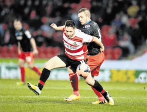 STARTING LINE: Dean Furman fights for Doncaster Rovers PhotO: Getty Images