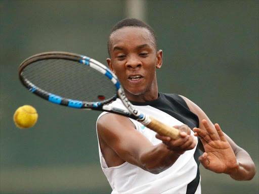 Olivier Kigotho returns to Ananda Petty during the All Africa Games preliminary trials at Nairobi Club on June 6, 2015. Photo/Mohammed Amin/www.pic-centre.com (KENYA)