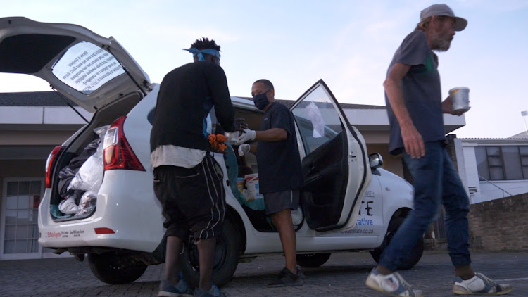 Brian Francis, centre, during an outreach feeding project where food was handed out to homeless people on the streets of East London during the Covid-19 lockdown.