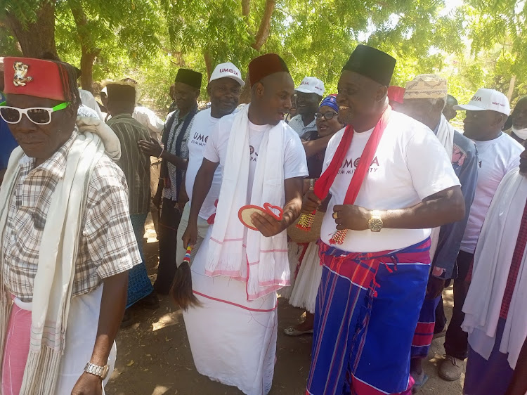 USPK officials accompany party leader Walter Mong'are Nyambane to the Magarini Cultural Centre in Kilifi county on Tuesday.