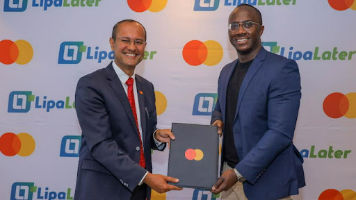 (L-R): Shehryar Ali, country manager for East Africa at MasterCard and Eric Muli, founder and CEO Lipa Later Group at the partnership signing in Nairobi.