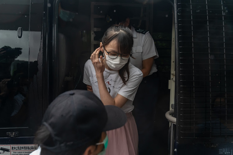 Hong Kong pro-democracy activist Agnes Chow steps out of a Hong Kong correctional services vehicle after being released from the Tai Lam Correctional Institution in Tuen Mun district on June 12 2021 in Hong Kong, China.