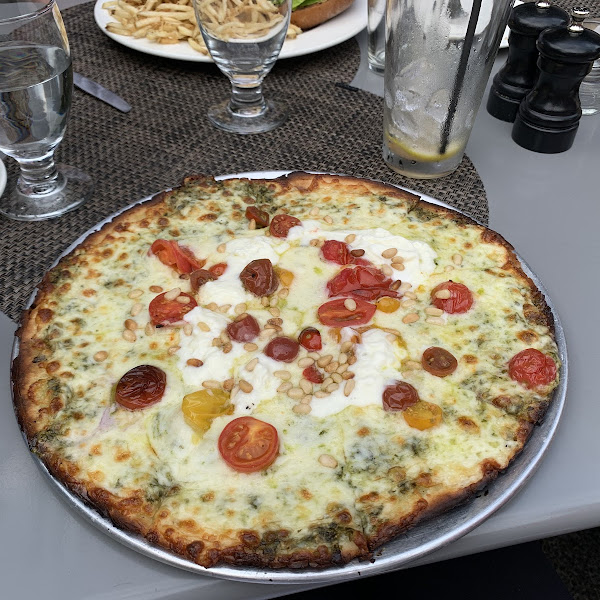 pesto pizza with cherry tomatoes and burrata