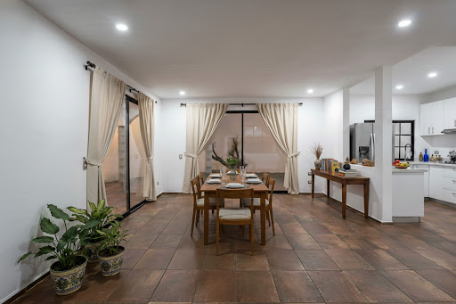 Dining room with set table in this luxury property for sale in San Miguel de Allende ($507,460)
