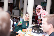 Guests take selfies inbetweem the unique experience at the Quartermain Hotel during Dinner Time Stories.