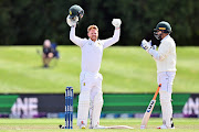 SA wicketkeeper-batter Kyle Verreynne celebrates his maiden hundred during day four of the second and final Test against New Zealand at Hagley Oval in Chirstchurch on February 27 2022.