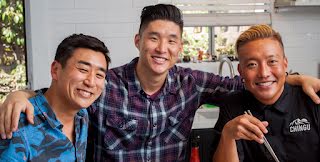 Three men looking at the camera, smiling