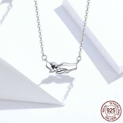 Title 1, Hands guarding mothers necklace gift