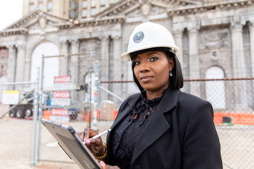 Business owner with a construction helmet