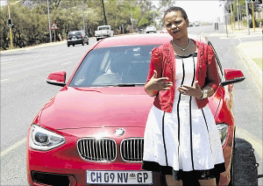 POWER LOSS: s ibongile Motloung with her BMW in Pretoria PHOTO: ANTONIO MUCHAVE