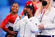 Simone Biles of Team United States reacts during the Women's Team Final on day four of the Tokyo 2020 Olympic Games at Ariake Gymnastics Centre on July 27, 2021 in Tokyo, Japan.