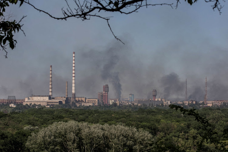 Smoke rises after a military strike on a compound of Sievierodonetsk's Azot Chemical Plant, amid Russia's attack on Ukraine, Lysychansk, Luhansk region, Ukraine June 10, 2022.