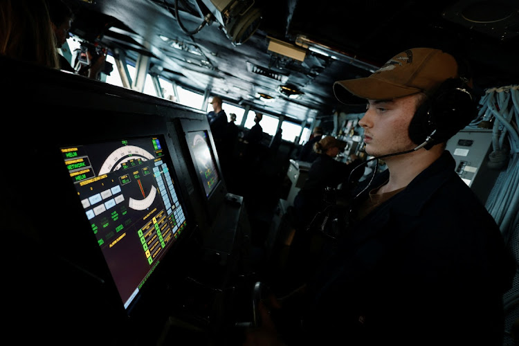 A US Navy sailor works during his day-shift at the flight-bridge of the USS Dwight D. Eisenhower (CVN 69) aircraft carrier in Southern Red Sea, Middle East, February 12, 2024.