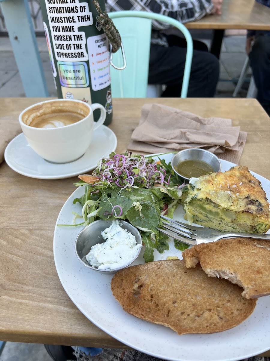 Frittata toast salad hot sauce and herb goat cheesw