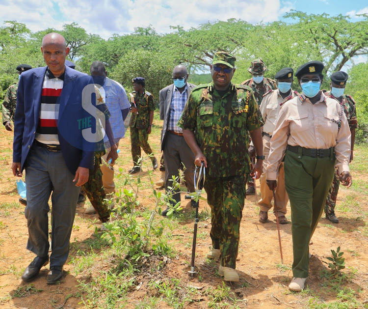 DCI boss Mohamed Amin with NPS IG Japhet Koome and officers at the Shakahola land in Kilifi County in April 24,2023.