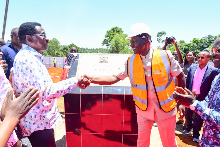 President William Ruto shaking hands Siaya Governor James Orengo after groundbreaking construction of a Level 4 hospital in Ugenya Constituency, Siaya on October 6, 2023