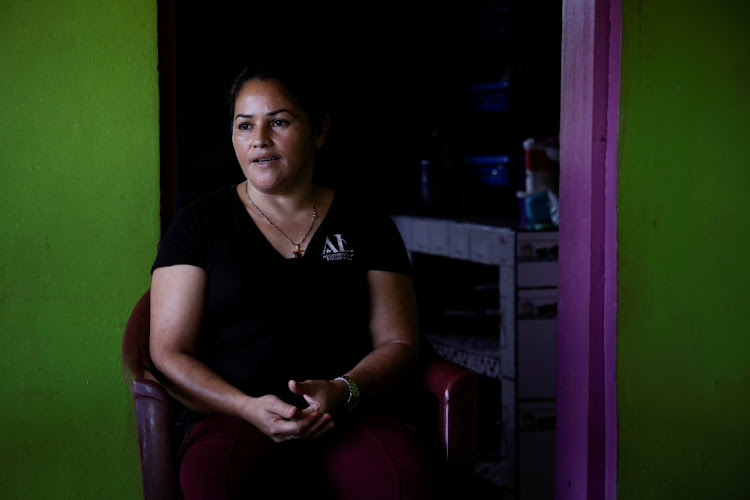 Coffee producer Maria Bonilla, whose 4 sons embarked on the treacherous journey to the US, speaks during an interview with Reuters in her house, at a coffee farm in El Laurel, in the state of Olancho, Honduras on September 22 2021. Picture: REUTERS/FREDY RODRIGUEZ