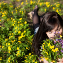 Girl in the middle of a flower garden