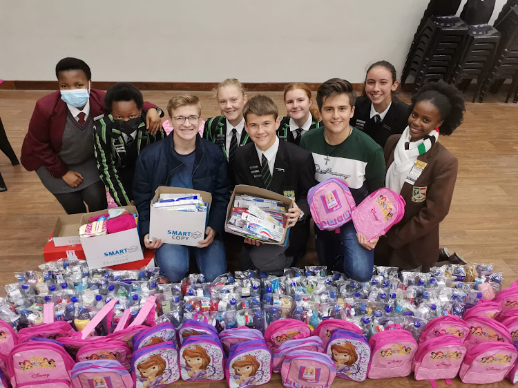 Junior City Council mayor Jason Kilian, front centre, and the councillors witht donations for underprivileged children