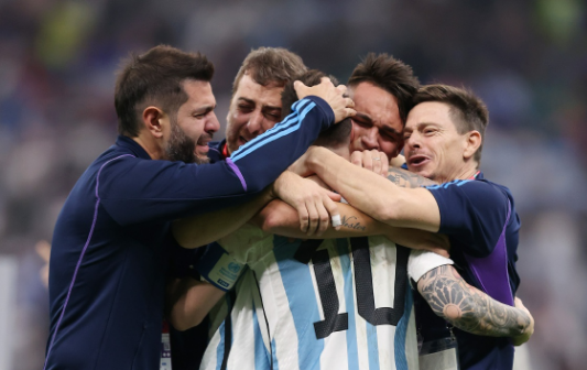 Lionel Messi of Argentina celebrates with teammates after their victory in the penalty shoot-out to win the Fifa World Cup Qatar 2022 final against France in Lusail City, Qatar at Lusail Stadium on December 18 2022.