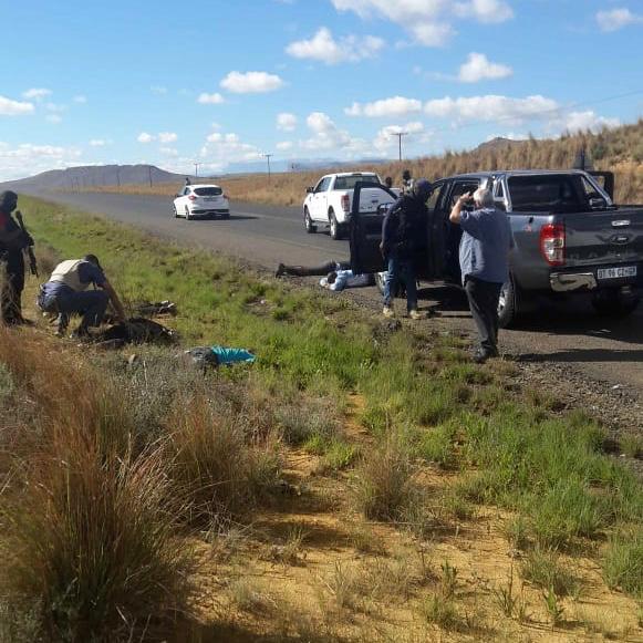 Heavily armed police stand over several men alleged to have been poised to carry out a heist in QwaQwa in the Free State on Thursday, November 22. Good teamwork among various anti-crime elements allowed the suspects to be tracked as they drove through the province.