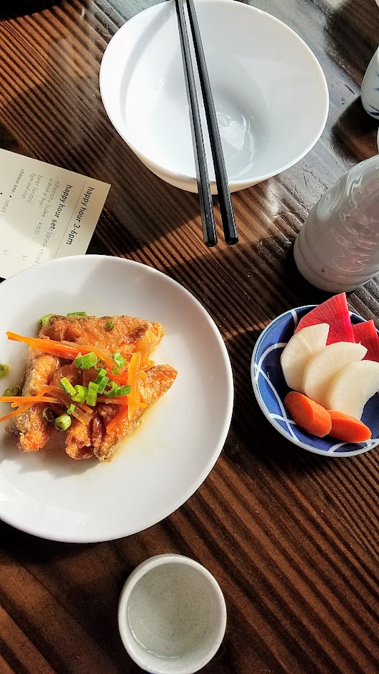 Marukin Ramen side (also available at happy hour) of salmon nanbanzuke, a dish of marinated salmon and pickled vegetables and nukazuke, or Japanese pickled vegetables