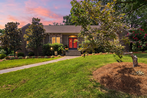 Prestige property for sale in Louisville (United States) - Red brick house, green garden, sunset sky