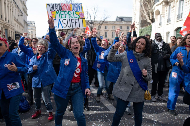 Demonstrators at a protest against pension reform in Paris, France, on March 16 2023. President Emmanuel Macron will use executive fiat to push through his unpopular pension reform that will raise the French retirement age to 64, effectively bypassing the lower house of parliament. Picture: Benjamin Girette/Bloomberg